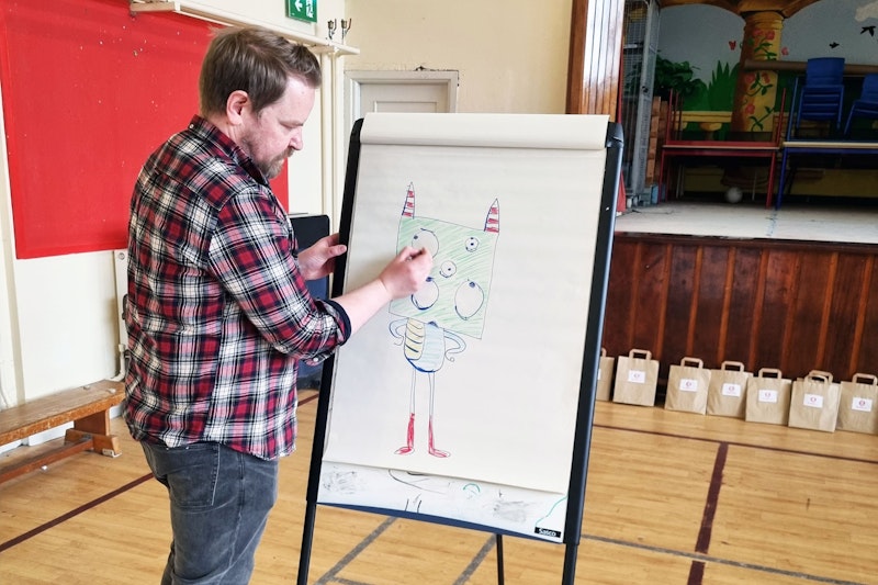 Brown Bag Films' 2D Designer Danny Shiels sharing Monster Doodle tips with students